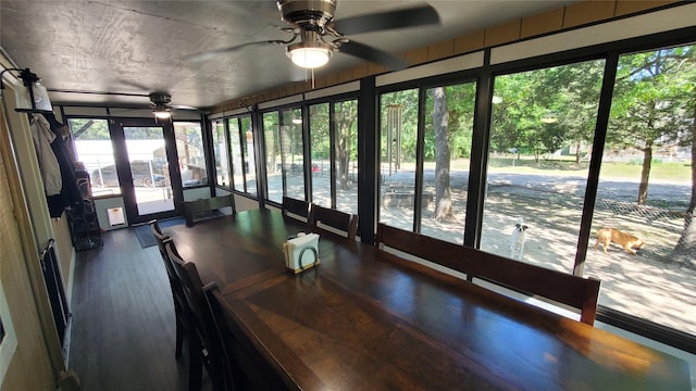 unfurnished sunroom featuring wood finished floors
