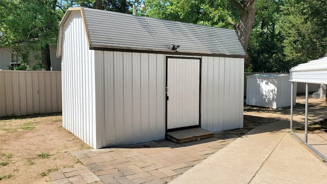 view of shed with fence