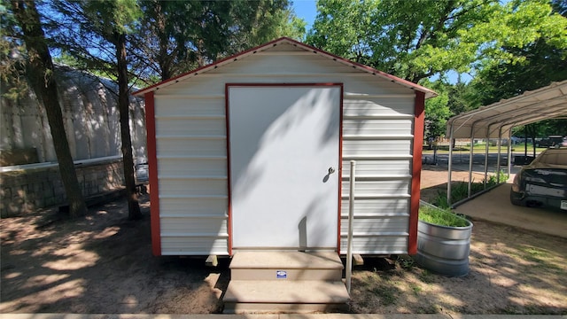 view of shed with fence