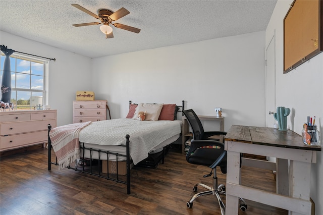 bedroom with a ceiling fan, wood finished floors, and a textured ceiling
