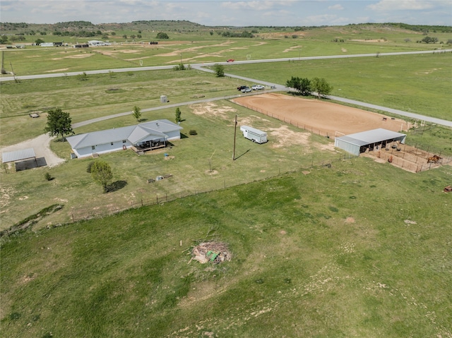 birds eye view of property with a rural view