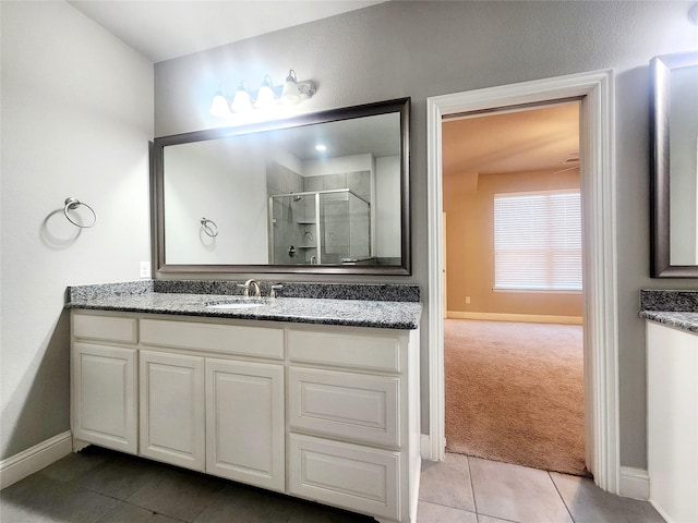 838 Milton Way, Coppell, TX 75019 - bathroom with baseboards, vanity, a shower stall, and tile patterned flooring