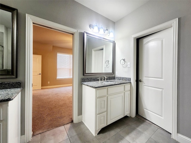 838 Milton Way, Coppell, TX 75019 - bathroom featuring vanity, tile patterned floors, and baseboards