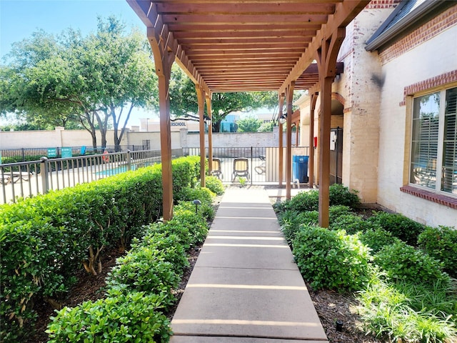 view of property's community featuring fence