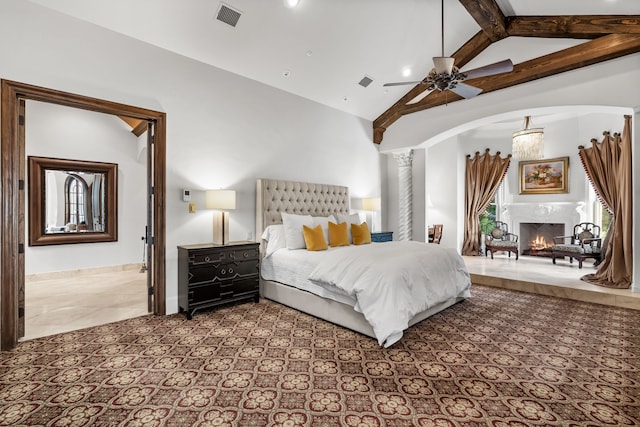 bedroom featuring high vaulted ceiling, arched walkways, visible vents, and ornate columns