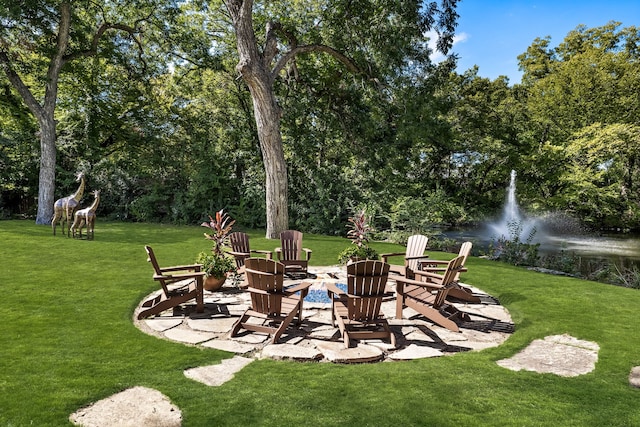 view of yard featuring an outdoor fire pit
