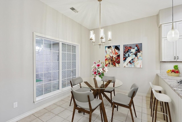 3027 Squireswood Dr, Carrollton, TX 75006 - dining room with a chandelier, light tile patterned floors, and baseboards