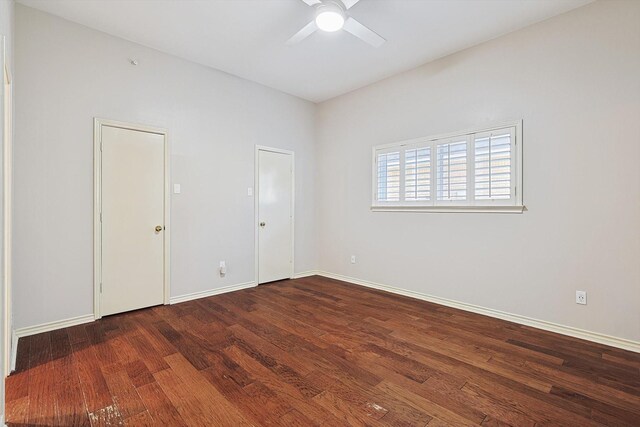 unfurnished bedroom featuring ceiling fan, baseboards, and wood finished floors