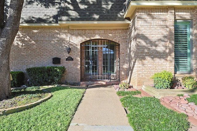 3027 Squireswood Dr, Carrollton, TX 75006 - doorway to property with brick siding and roof with shingles