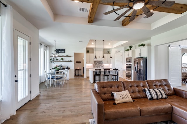 120 Southern Ct, Springtown, TX 76082 - living area featuring a raised ceiling, visible vents, light wood-style floors, beam ceiling, and ceiling fan
