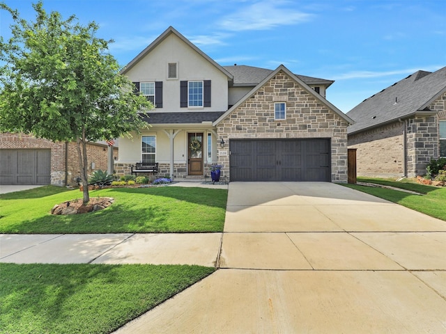 220 Glenwood Dr, Oak Point, TX 75068 - traditional home featuring a porch, a front lawn, stone siding, concrete driveway, and stucco siding