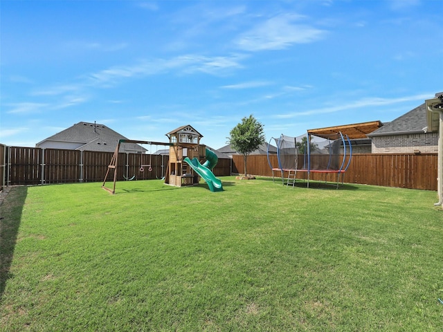 220 Glenwood Dr, Oak Point, TX 75068 - view of yard featuring a trampoline, a fenced backyard, and a playground