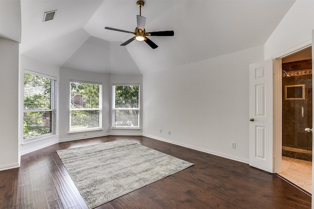 6807 Lagoon Dr, Grand Prairie, TX 75054 - empty room with ceiling fan, lofted ceiling, dark wood finished floors, and baseboards