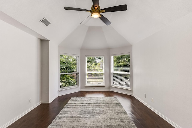 6807 Lagoon Dr, Grand Prairie, TX 75054 - spare room featuring healthy amount of natural light, dark wood-style flooring, ceiling fan, and lofted ceiling