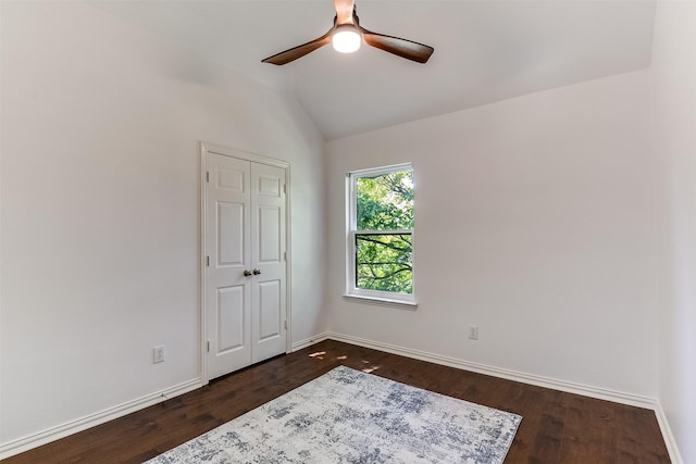 6807 Lagoon Dr, Grand Prairie, TX 75054 - unfurnished bedroom featuring dark wood finished floors, baseboards, lofted ceiling, and a ceiling fan