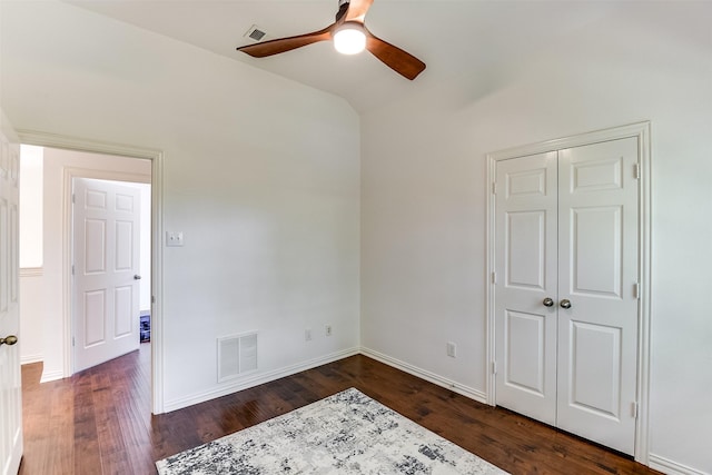 6807 Lagoon Dr, Grand Prairie, TX 75054 - unfurnished bedroom featuring dark wood finished floors, lofted ceiling, baseboards, a ceiling fan, and a closet