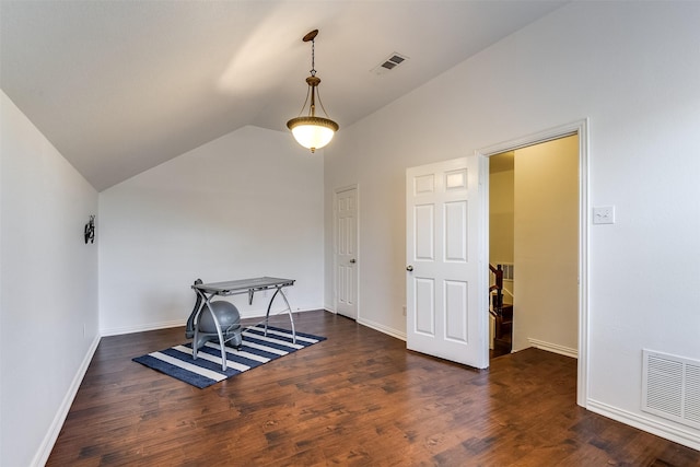 6807 Lagoon Dr, Grand Prairie, TX 75054 - dining space with vaulted ceiling, wood finished floors, and baseboards