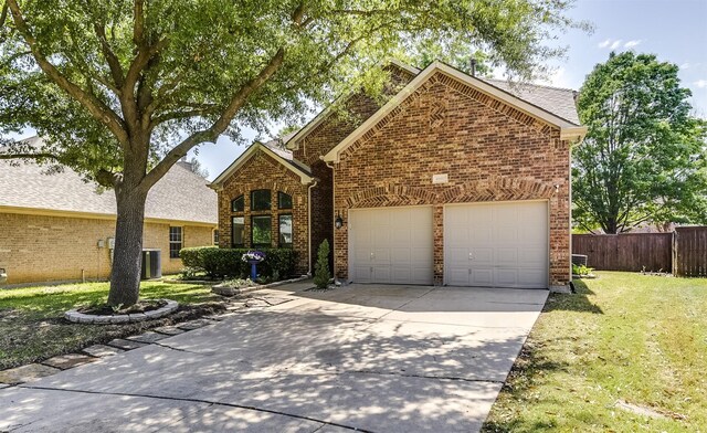 6807 Lagoon Dr, Grand Prairie, TX 75054 - traditional-style home with brick siding, driveway, an attached garage, and central AC
