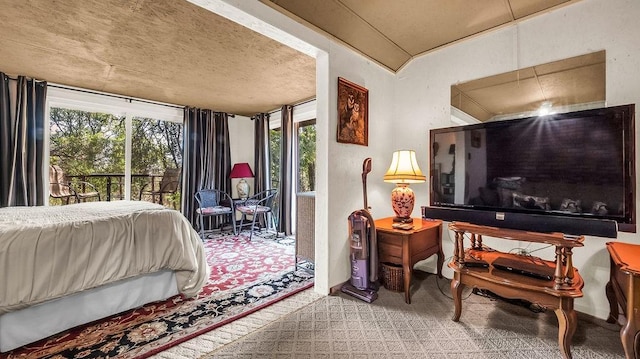 carpeted bedroom featuring access to outside