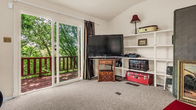 playroom with lofted ceiling, visible vents, and carpet flooring