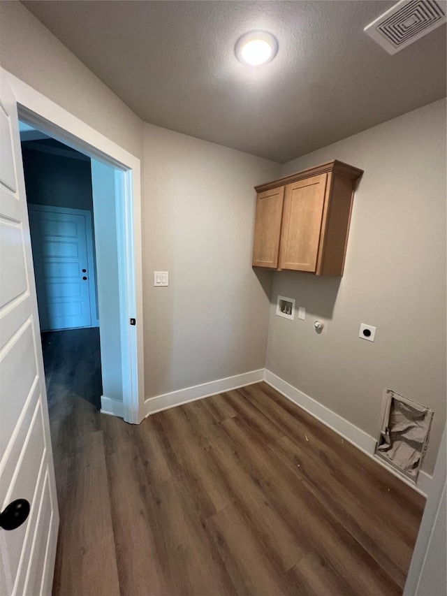 washroom with visible vents, hookup for an electric dryer, baseboards, washer hookup, and dark wood-style flooring
