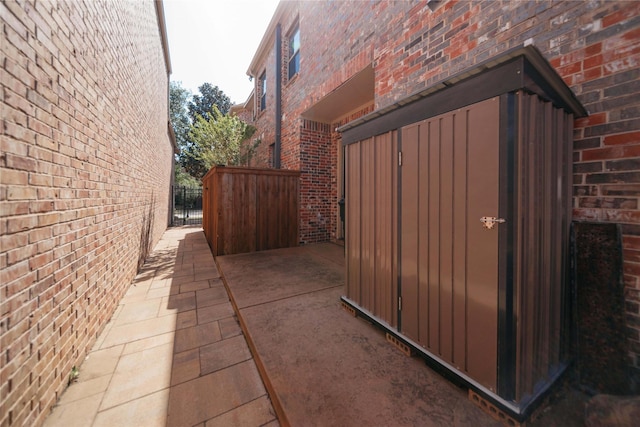 2905 White Dove Dr, Plano, TX 75093 - view of side of property with brick siding and a gate
