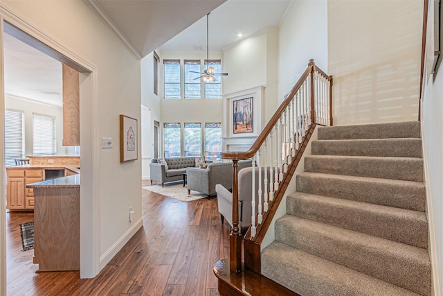 7905 Vista Ridge Dr S, Fort Worth, TX 76132 - entryway with a ceiling fan, dark wood finished floors, stairway, and a healthy amount of sunlight