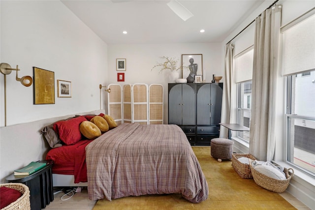 bedroom with recessed lighting and multiple windows