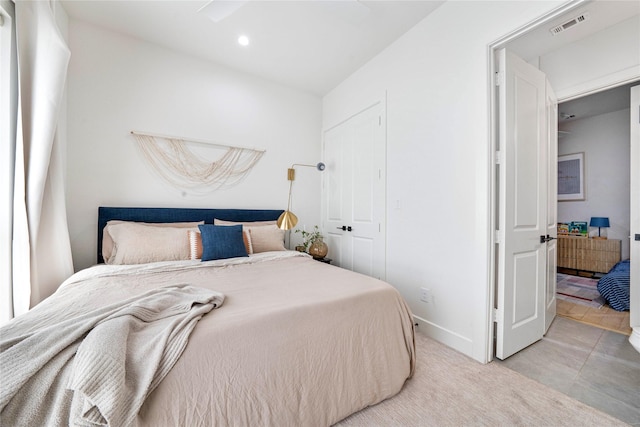 bedroom with baseboards, visible vents, and recessed lighting