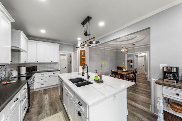 kitchen featuring crown molding, a sink, white cabinetry, backsplash, and appliances with stainless steel finishes