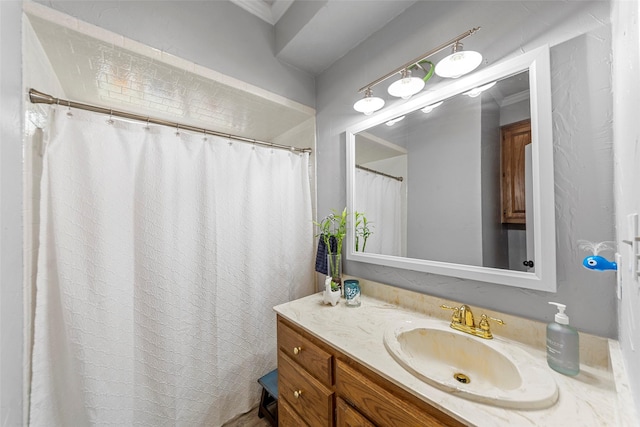bathroom featuring vanity and ornamental molding