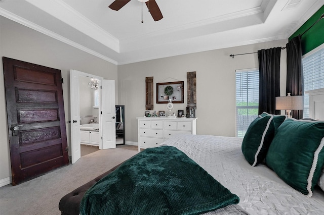 bedroom featuring light carpet, baseboards, a raised ceiling, and crown molding