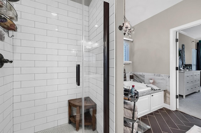 bathroom with a garden tub and a stall shower