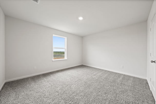 carpeted spare room with baseboards and recessed lighting