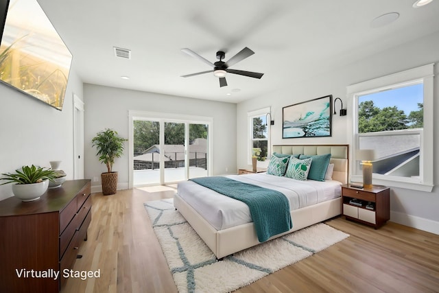 bedroom featuring recessed lighting, visible vents, access to exterior, light wood-type flooring, and baseboards