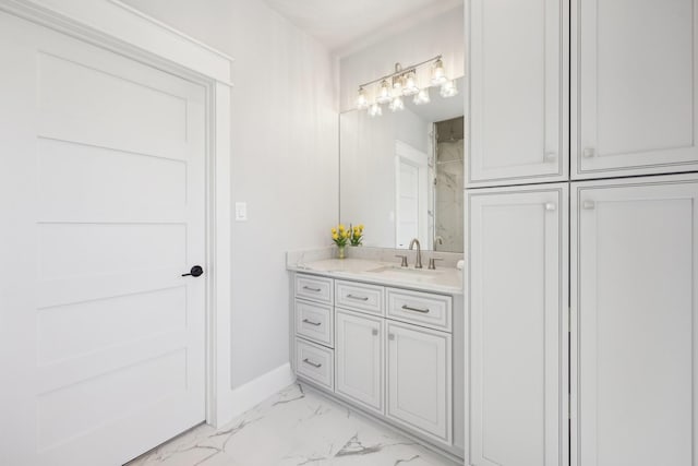 bathroom featuring walk in shower, baseboards, marble finish floor, and vanity
