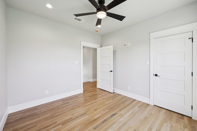 unfurnished bedroom featuring light wood finished floors, baseboards, visible vents, and recessed lighting