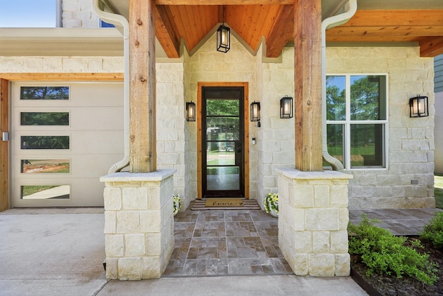 property entrance featuring stone siding and a porch