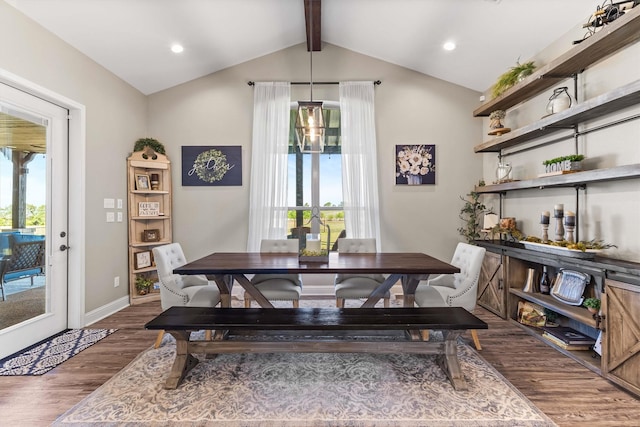 dining room with baseboards, wood finished floors, lofted ceiling with beams, and plenty of natural light