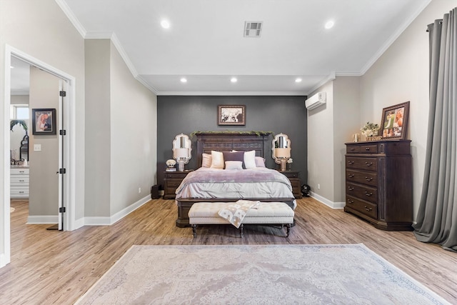 bedroom featuring baseboards, crown molding, light wood-style flooring, and a wall unit AC