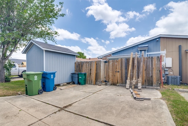 4430 Chapman St, The Colony, TX 75056 - exterior space featuring an outbuilding, central AC, and fence