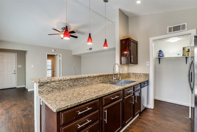 4430 Chapman St, The Colony, TX 75056 - kitchen with a peninsula, stainless steel dishwasher, a sink, and dark wood-type flooring