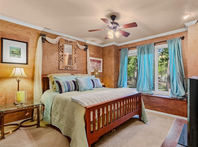 bedroom featuring carpet floors, ceiling fan, and ornamental molding