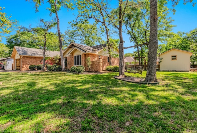 single story home featuring a front lawn and brick siding