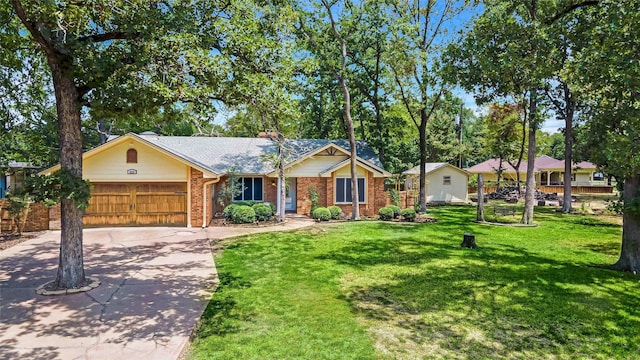 single story home with concrete driveway, an attached garage, brick siding, and a front lawn