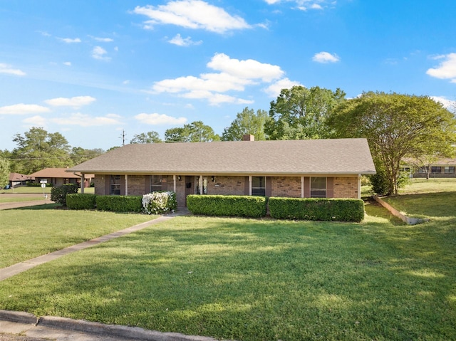 314 Cedar, Mount Pleasant, TX 75455 - single story home with brick siding, a chimney, and a front yard