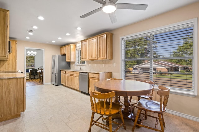 314 Cedar, Mount Pleasant, TX 75455 - kitchen with a ceiling fan, decorative backsplash, baseboards, appliances with stainless steel finishes, and recessed lighting