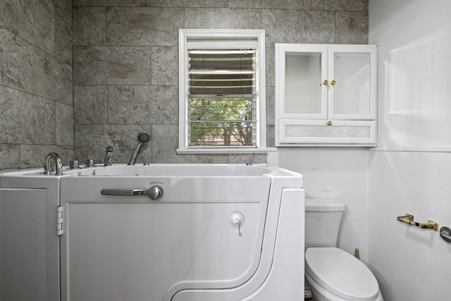 314 Cedar, Mount Pleasant, TX 75455 - bathroom with a tub to relax in and toilet
