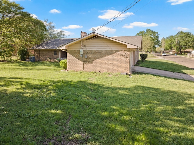 314 Cedar, Mount Pleasant, TX 75455 - view of property exterior with brick siding and a yard