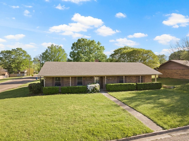 314 Cedar, Mount Pleasant, TX 75455 - ranch-style home featuring brick siding and a front lawn